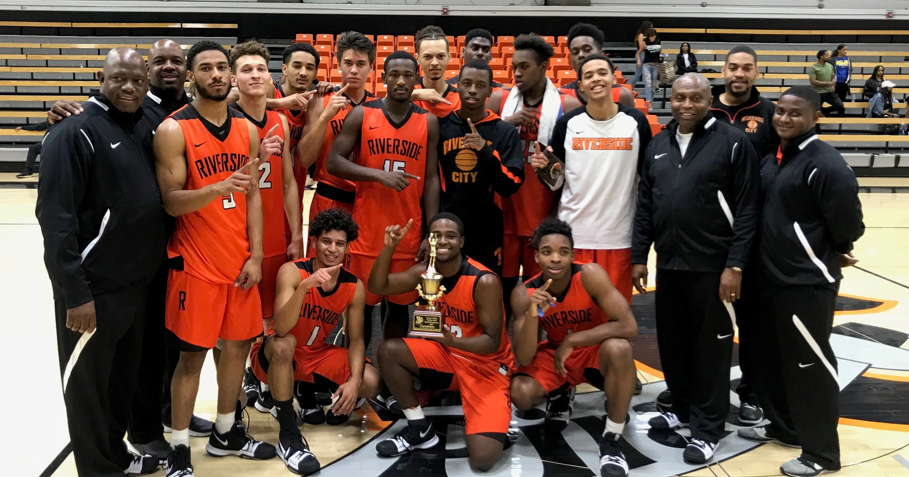Men's basketball hoists the Ventura College Championship trophy after defeating Orange Coast in the finals. The Tigers begin their season 3-0. (Photo compliments of Tommie Denson)