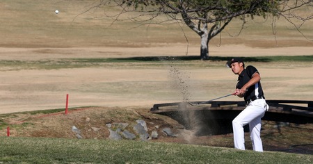 Michael Herrera works his way out of the sand at the Victoria Club during his round at the Riverside Invitational. He finished with a 73. (Photo by Bobby R. Hester)